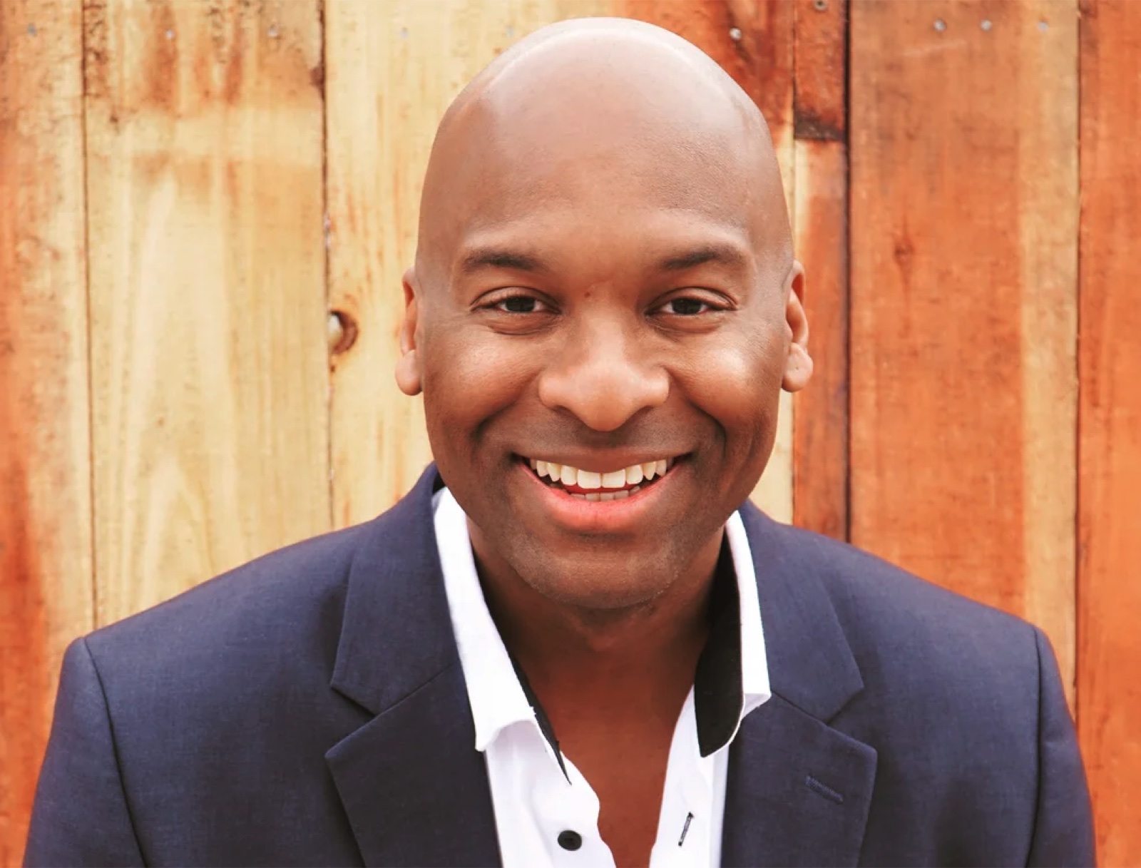 Uchenna Martin Anyanwu smiling in a navy jacket